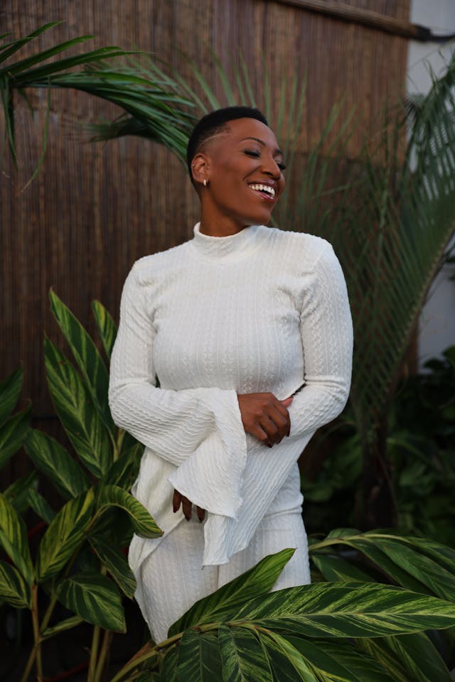 Woman smiling in white blouse