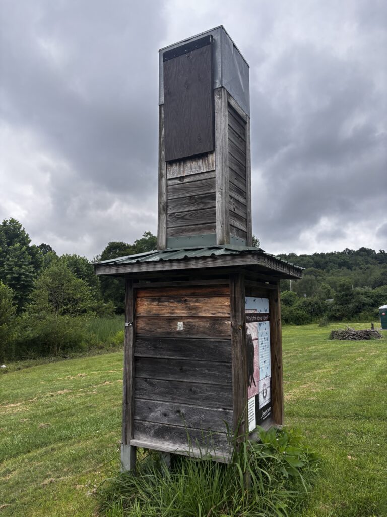 Bird tower in the field side view