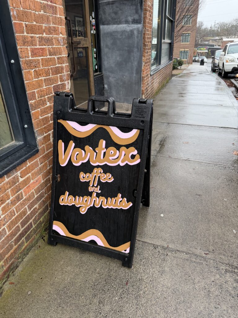 a frame sign for Vortex Coffee and Doughnuts